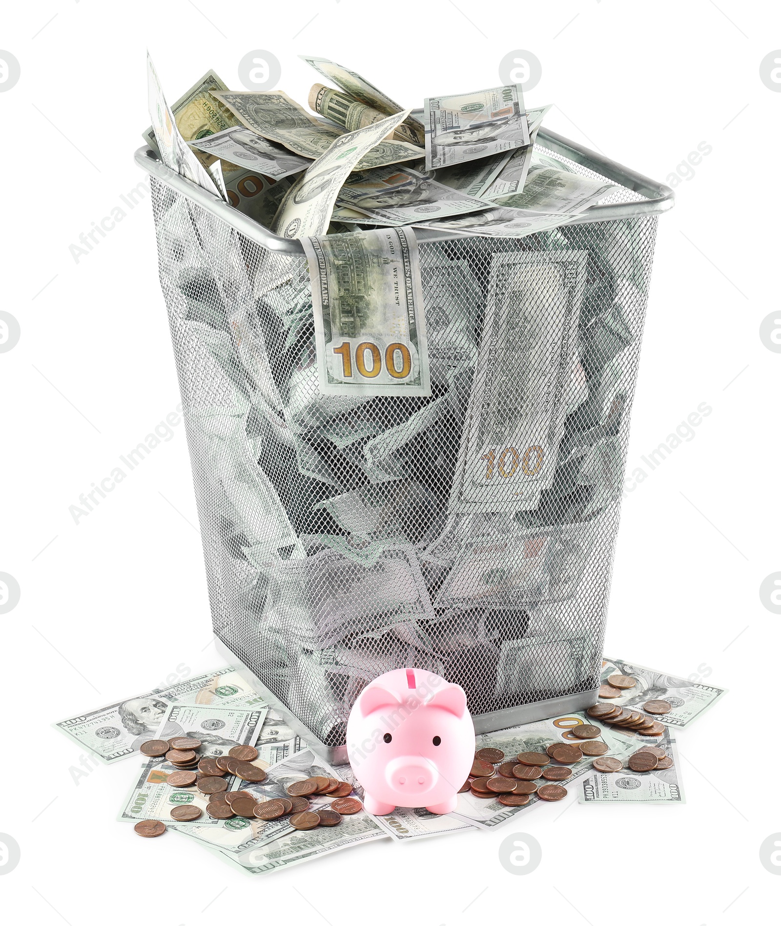 Photo of Many dollar banknotes in trash bin, coins and piggy bank isolated on white