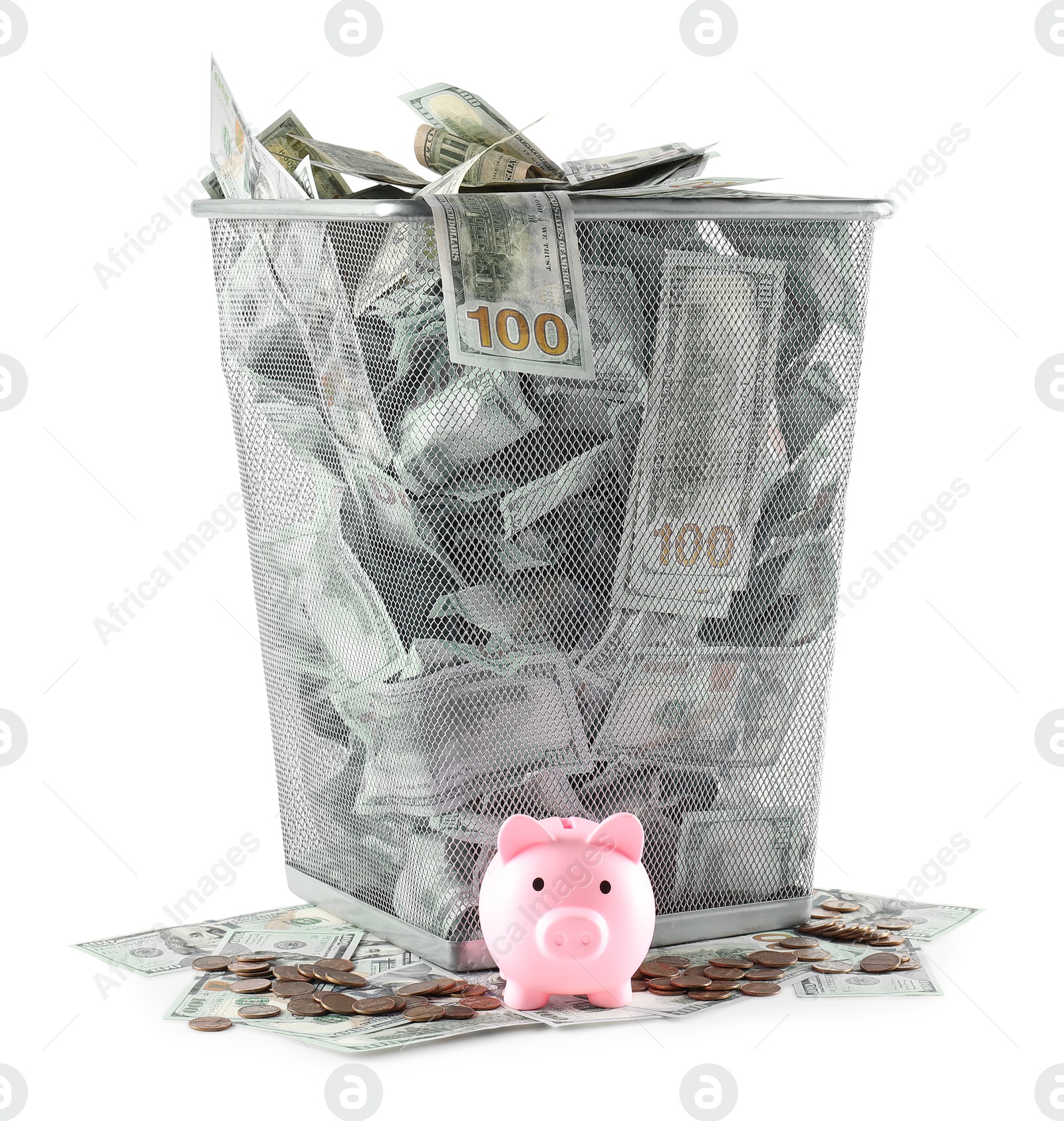 Photo of Many dollar banknotes in trash bin, coins and piggy bank isolated on white