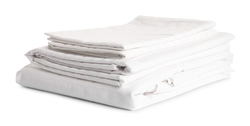 Photo of Stacked clean bed linens on white background