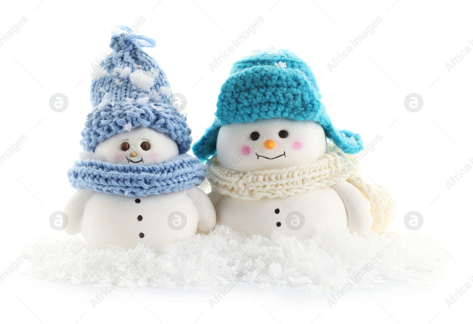 Photo of Cute decorative snowmen and artificial snow isolated on white