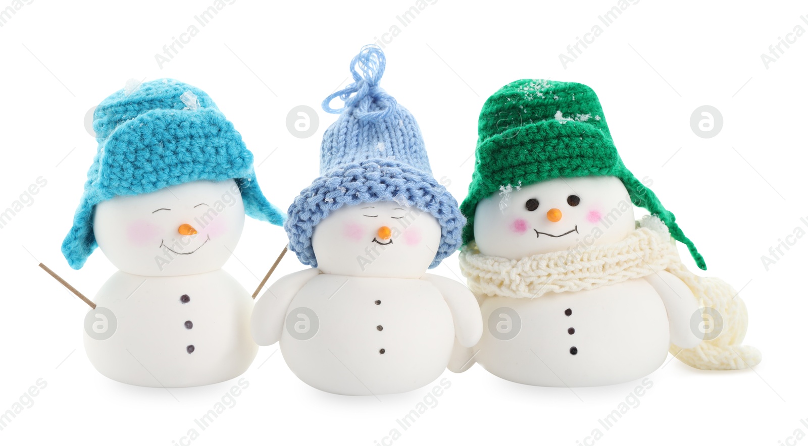 Photo of Many cute decorative snowmen isolated on white