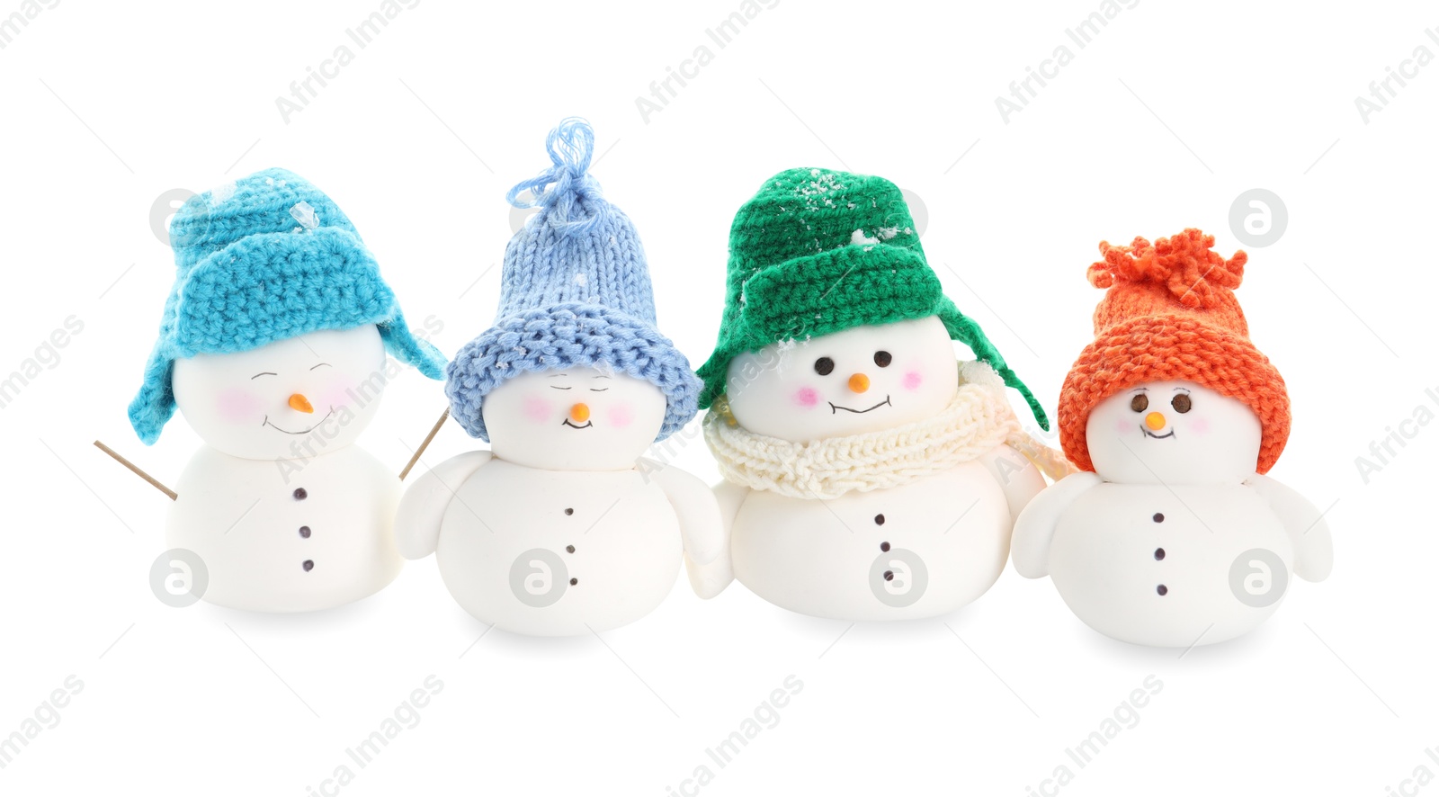 Photo of Many cute decorative snowmen isolated on white