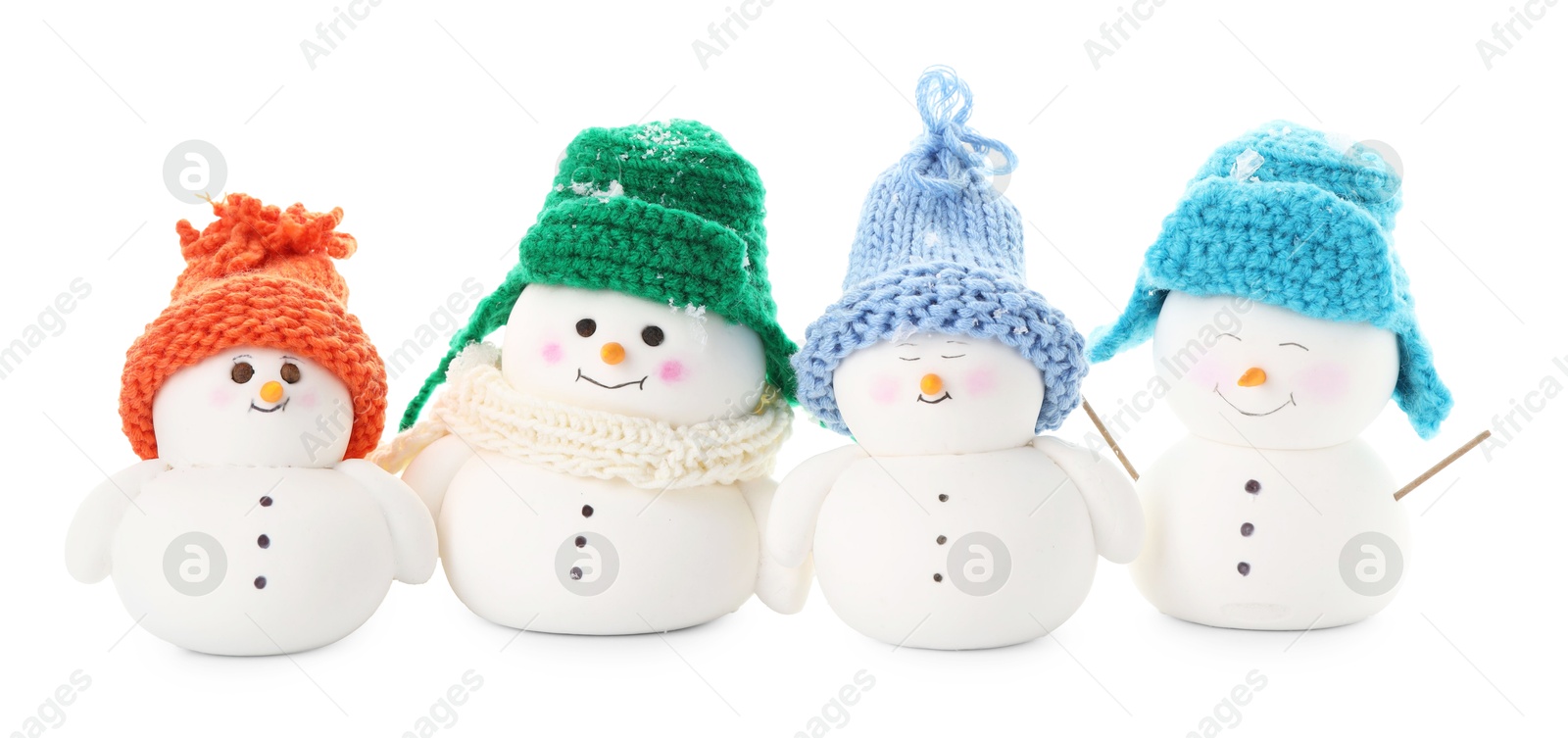 Photo of Many cute decorative snowmen isolated on white