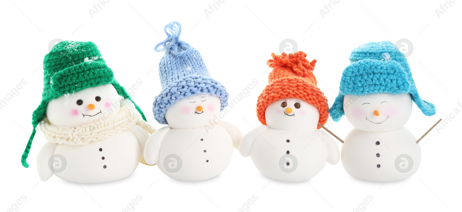 Photo of Many cute decorative snowmen isolated on white