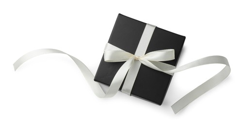 Beautiful black gift box with bow isolated on white