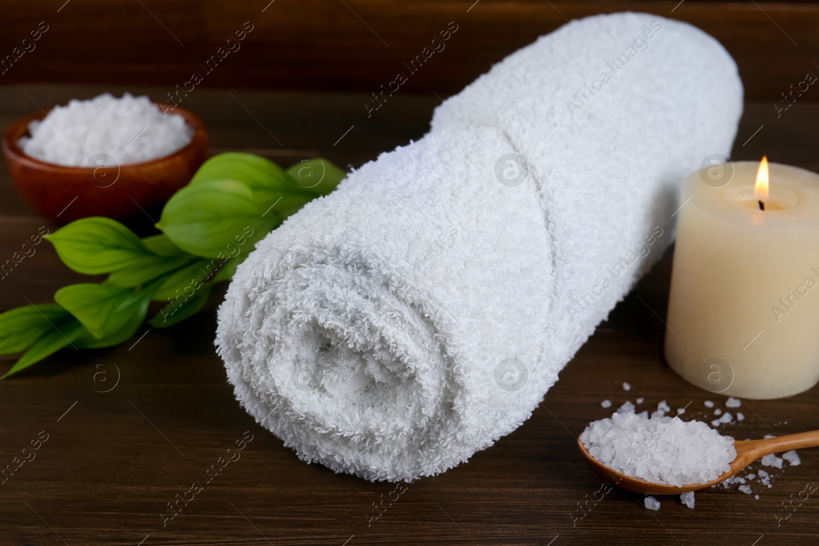 Photo of Composition with different spa supplies on wooden table, closeup