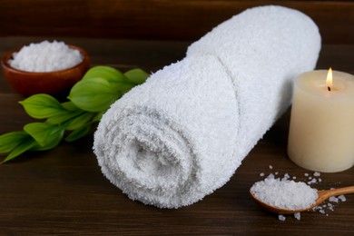 Photo of Composition with different spa supplies on wooden table, closeup