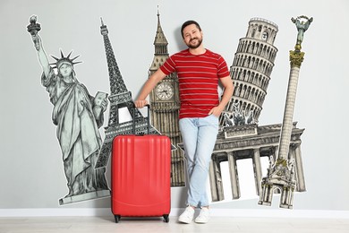 Happy traveler with suitcase on light grey background. Illustration of famous landmarks behind man