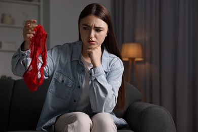 Photo of Frustrated wife with mistress panties alone at home. Space for text