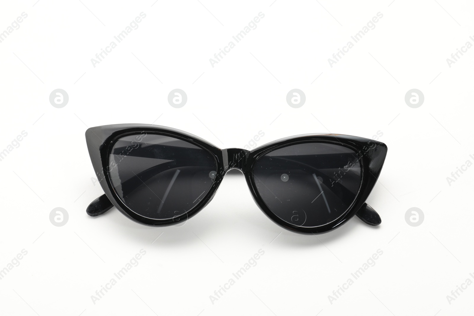 Photo of Stylish sunglasses on white background. Elegant accessory