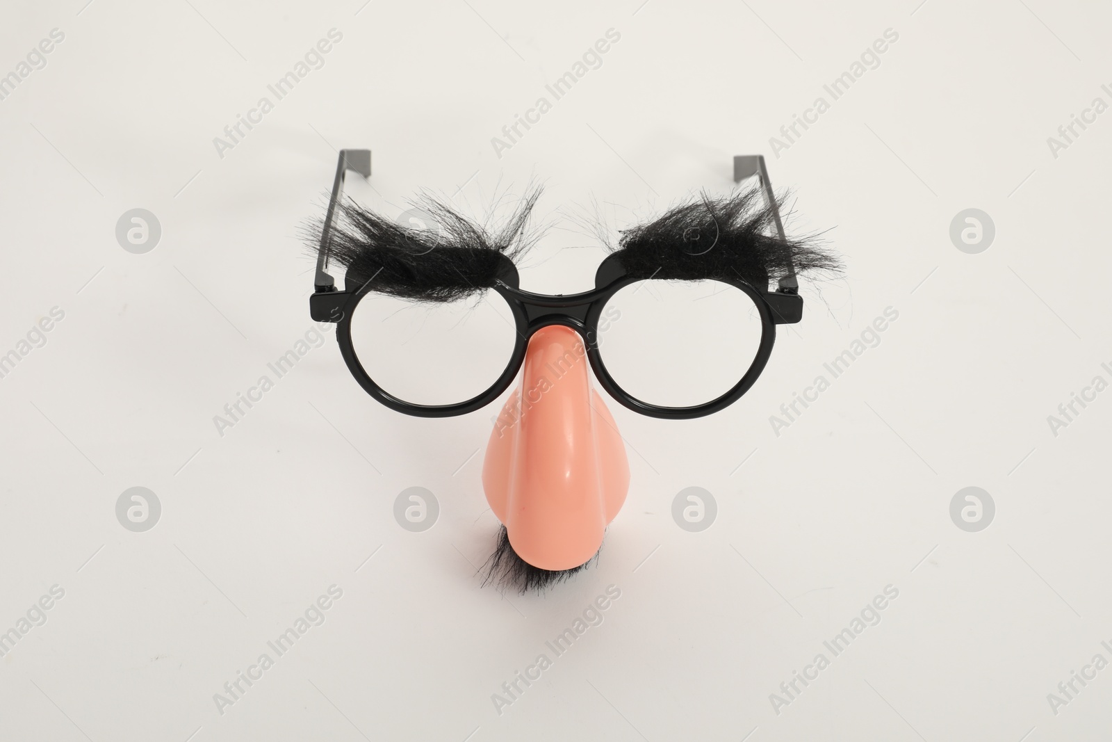 Photo of Funny mask with glasses, fake mustache and nose on white background