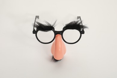 Funny mask with glasses, fake mustache and nose on white background