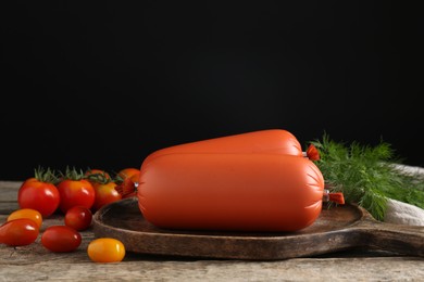 Photo of Tasty boiled sausages, tomatoes and dill on wooden table