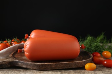 Photo of Tasty boiled sausages, tomatoes and dill on wooden table