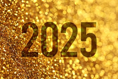 Image of 2025 New Year greeting card with golden sparkles