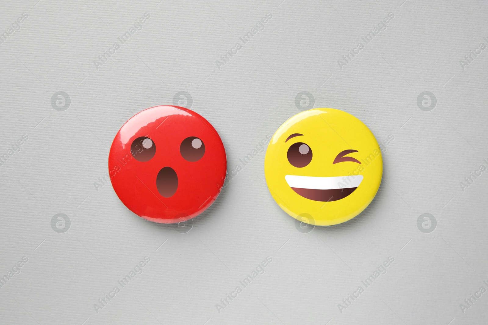 Image of Badges displaying different emotions on grey background