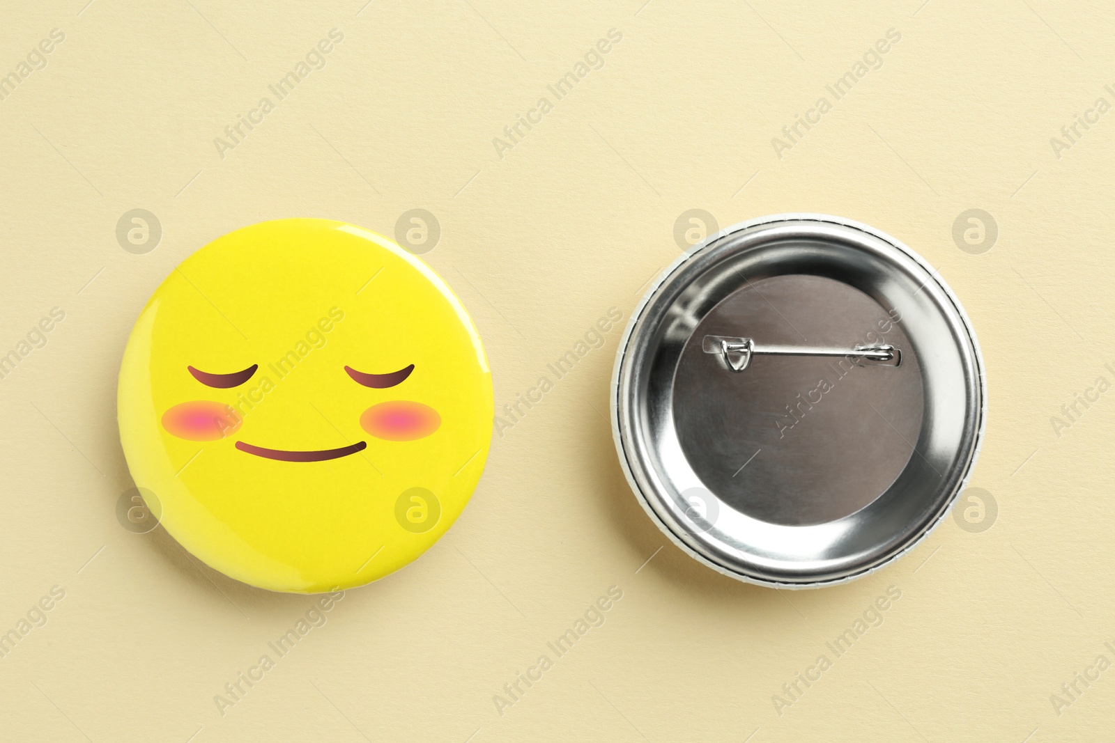 Image of Badges on beige background. One with shy or pleased face