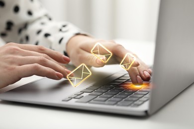 Image of Woman using laptop at table, closeup. Envelopes as symbol of message over computer