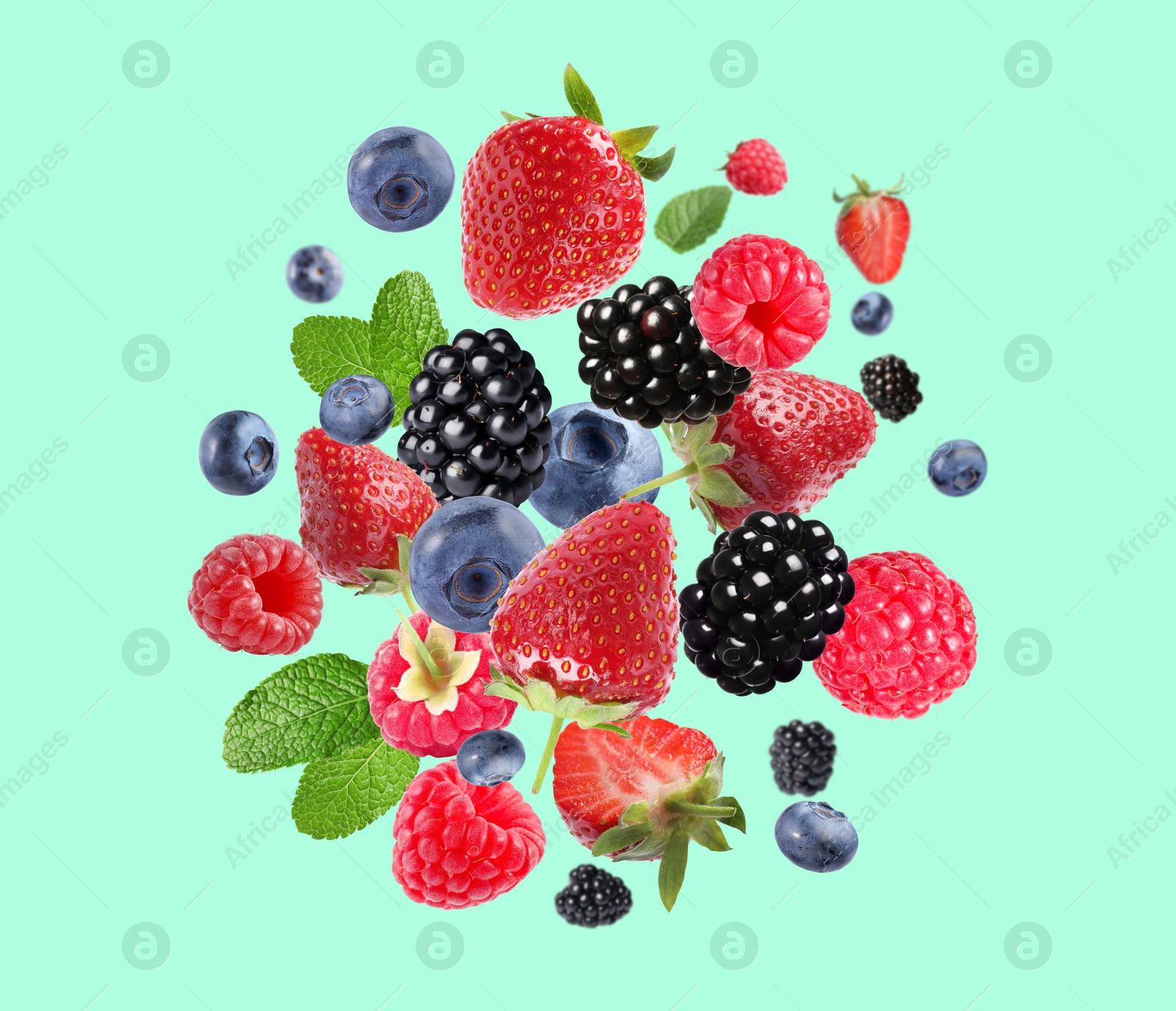 Image of Mix of fresh berries in air on turquoise background