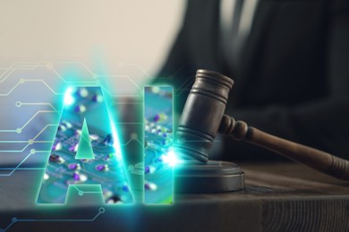 Image of Artificial intelligence and law. AI abbreviation and wooden gavel. Judge working at table, closeup