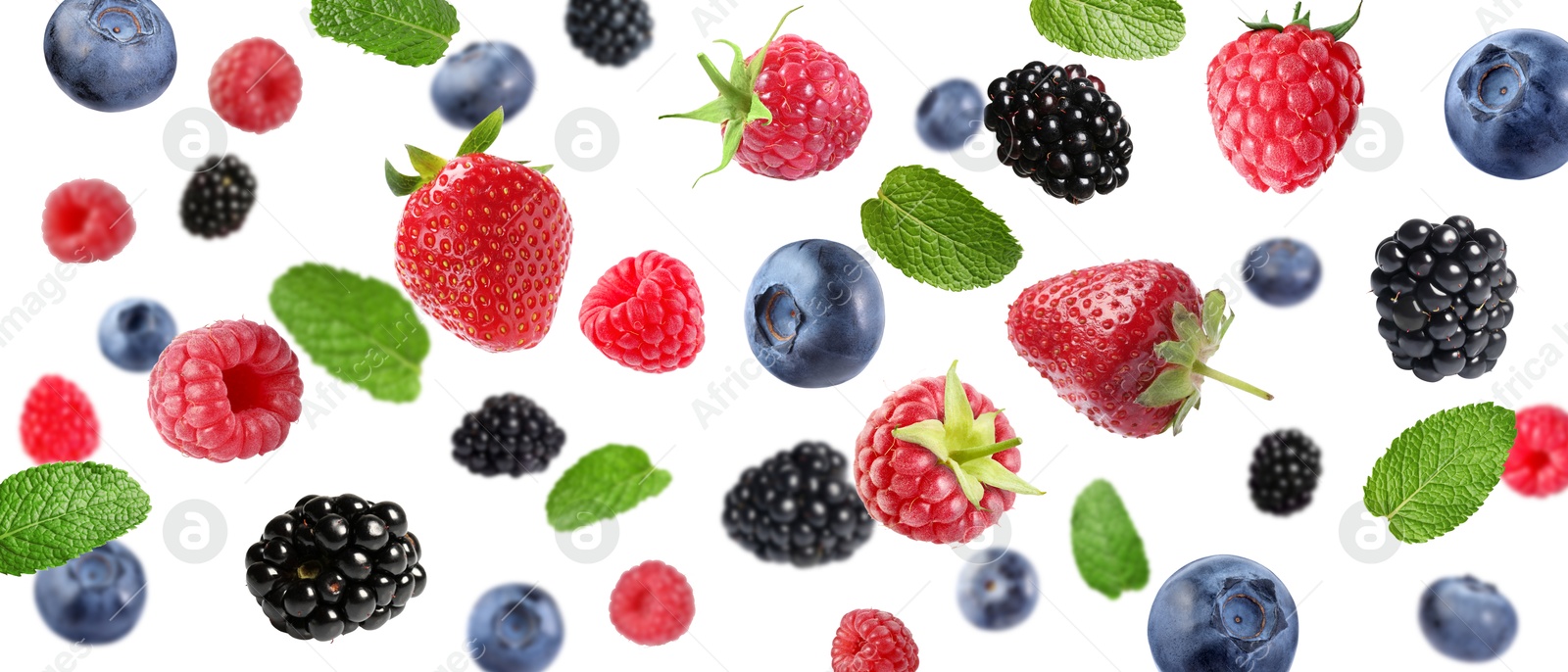 Image of Mix of fresh berries in air on white background