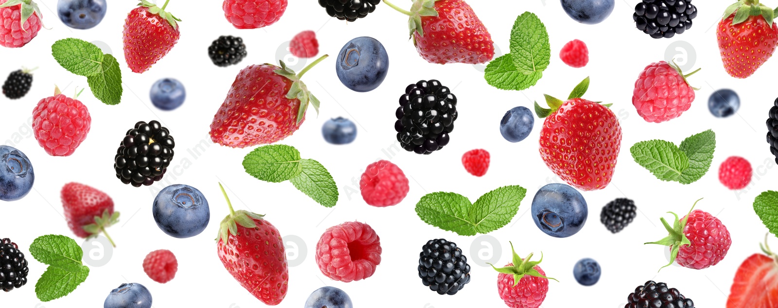 Image of Mix of fresh berries in air on white background