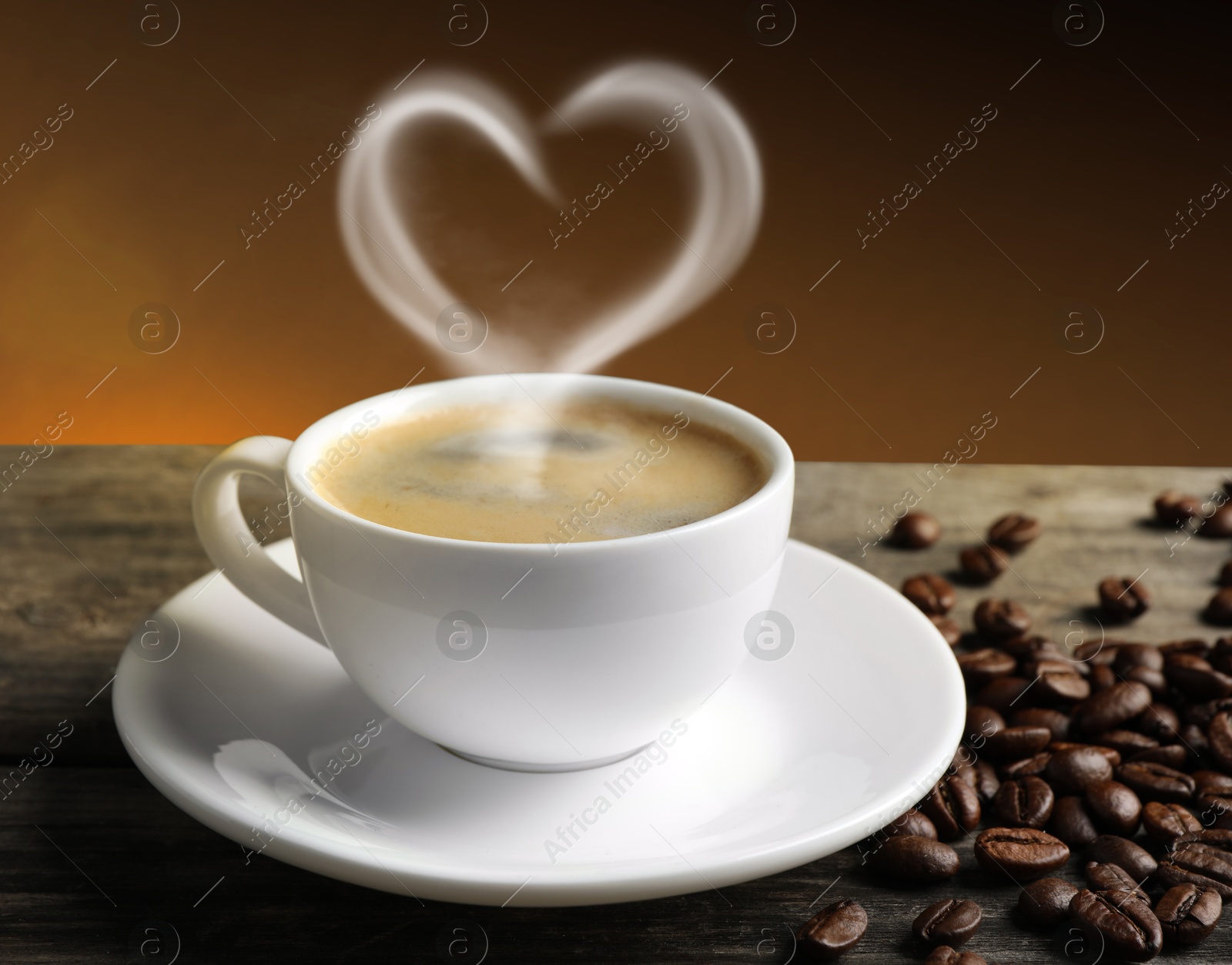 Image of Fresh aromatic coffee and beans on wooden table. Steam in shape of heart over cup