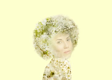 Attractive woman and blossoming spring tree on beige background, double exposure. Concept of beauty, femininity and inner peace