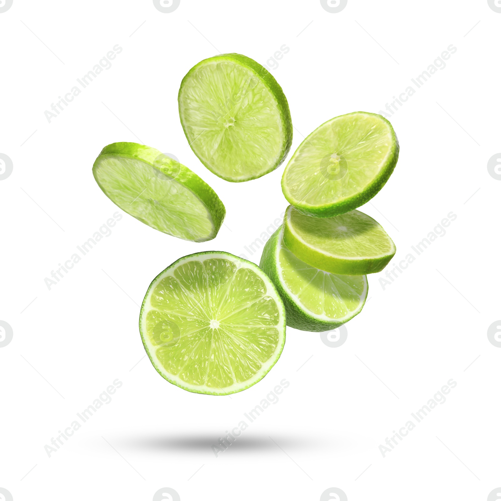 Image of Lime pieces in air on white background. Citrus fruit