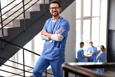 Photo of Healthcare workers in hospital, selective focus. Smiling nurse indoors