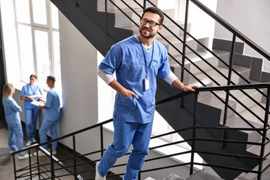 Photo of Healthcare workers in hospital, selective focus. Smiling nurse indoors