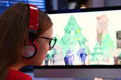 Girl watching game live stream indoors, closeup