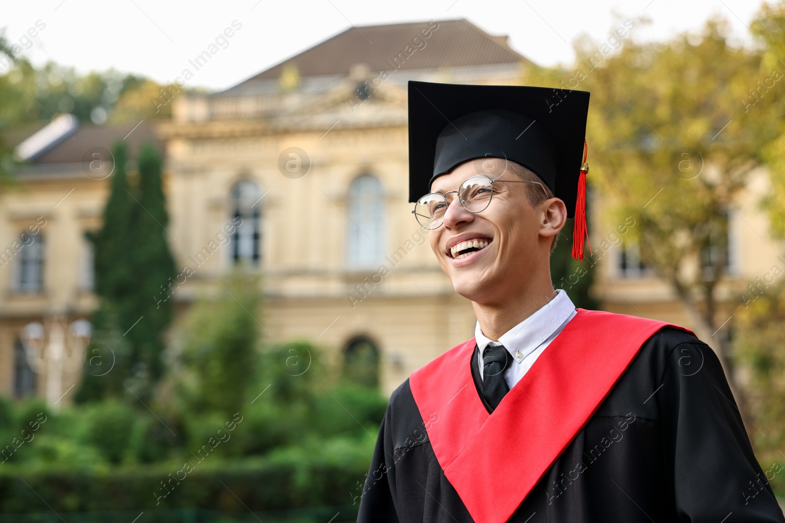 Photo of Graduation ceremony. Happy student outdoors, space for text