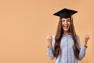 Photo of Happy student after graduation on beige background. Space for text