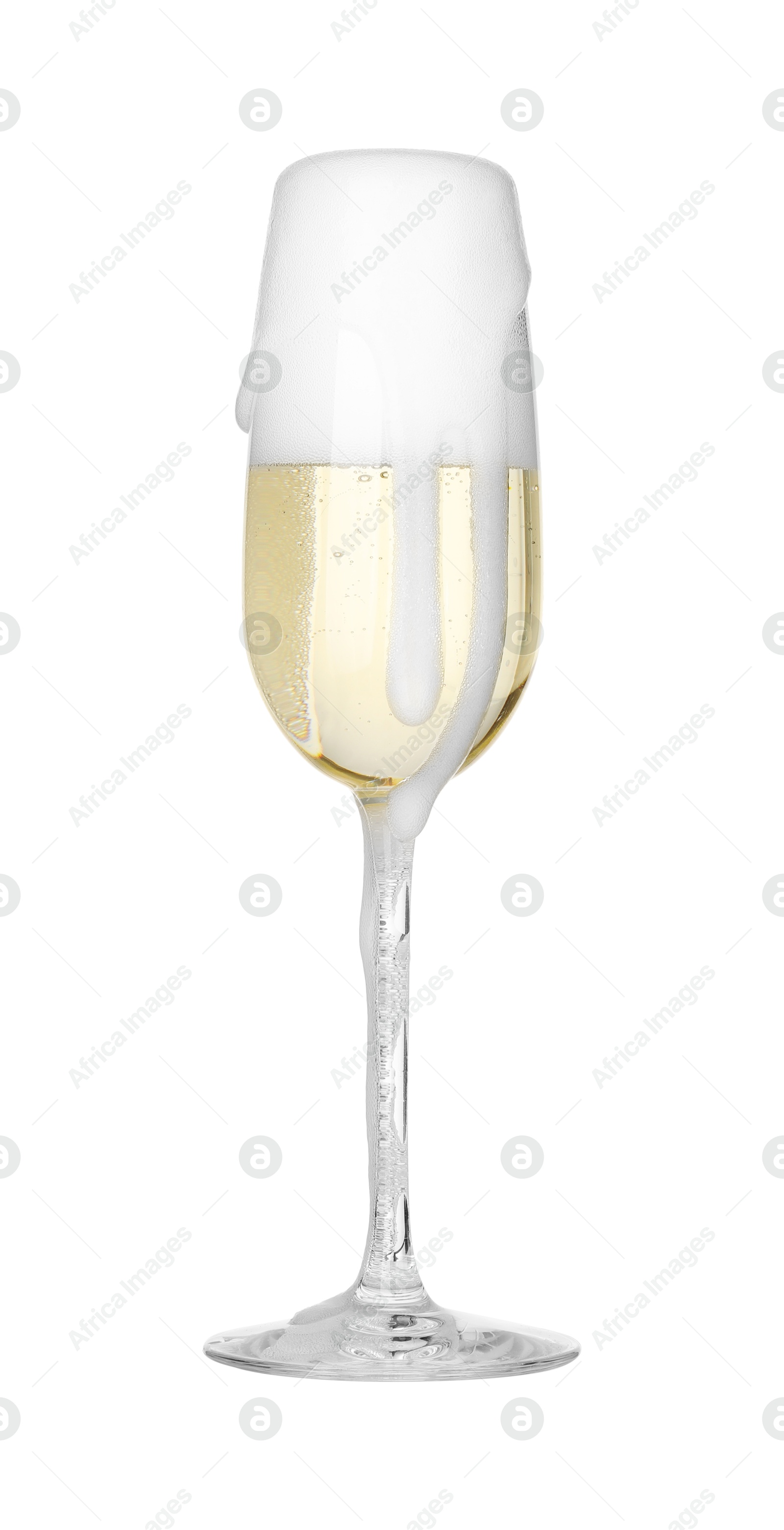 Photo of Glass overflowing with champagne isolated on white