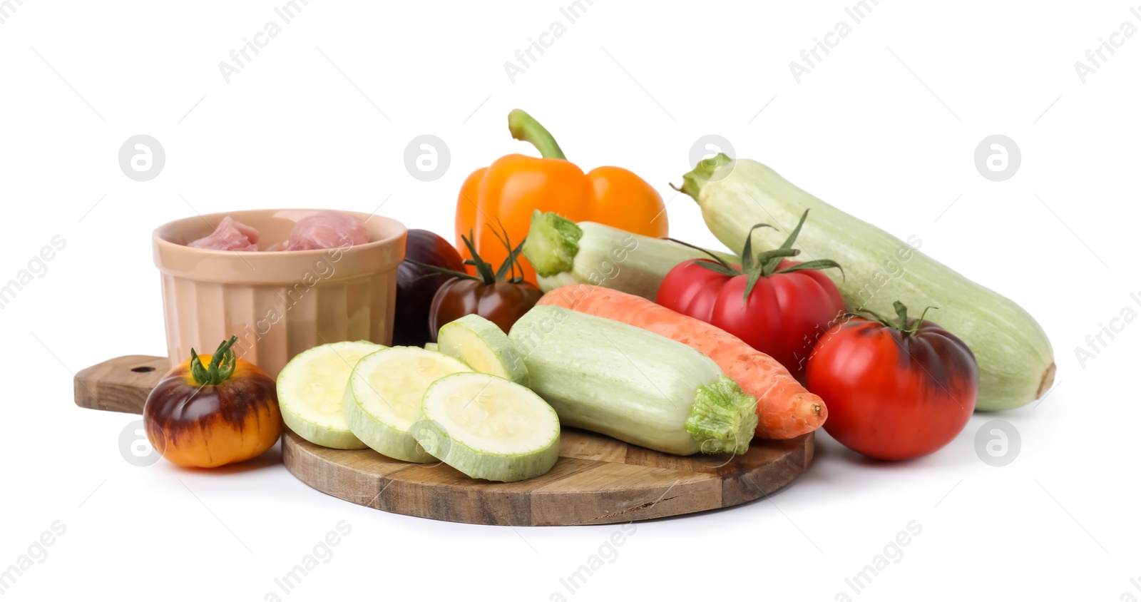 Photo of Different vegetables and raw meat for stew isolated on white