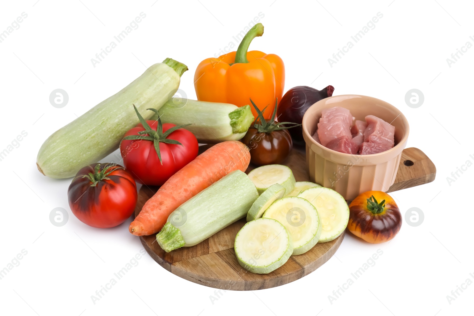 Photo of Different vegetables and raw meat for stew isolated on white