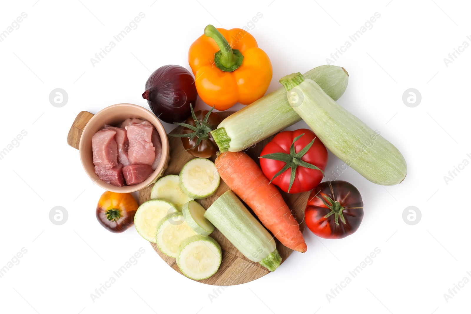 Photo of Different vegetables and raw meat for stew isolated on white, top view