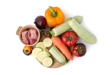 Different vegetables and raw meat for stew isolated on white, top view