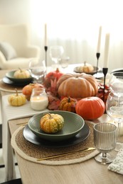 Stylish table setting with beautiful autumn decor in dining room