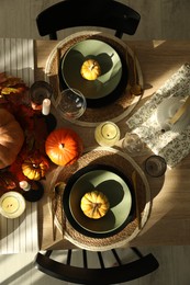 Stylish table setting with beautiful autumn decor in dining room, top view