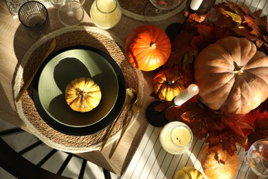 Stylish table setting with beautiful autumn decor in dining room, top view