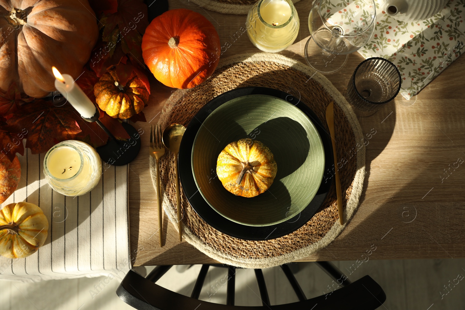 Photo of Stylish table setting with beautiful autumn decor in dining room, top view