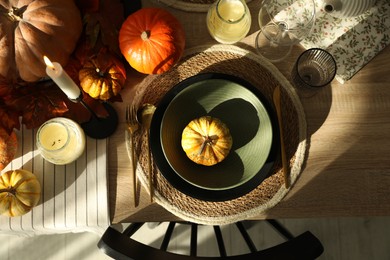 Stylish table setting with beautiful autumn decor in dining room, top view