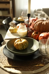 Stylish table setting with beautiful autumn decor in dining room