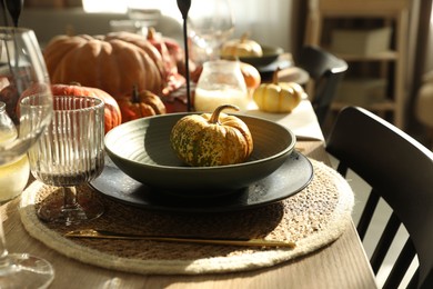 Stylish table setting with beautiful autumn decor in dining room