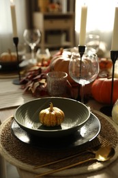 Stylish table setting with beautiful autumn decor in dining room