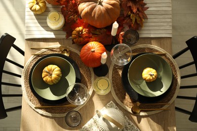 Stylish table setting with beautiful autumn decor in dining room, top view