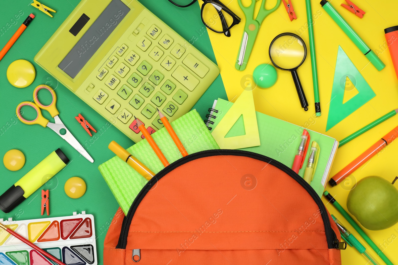 Photo of Backpack and different school supplies on color background, flat lay