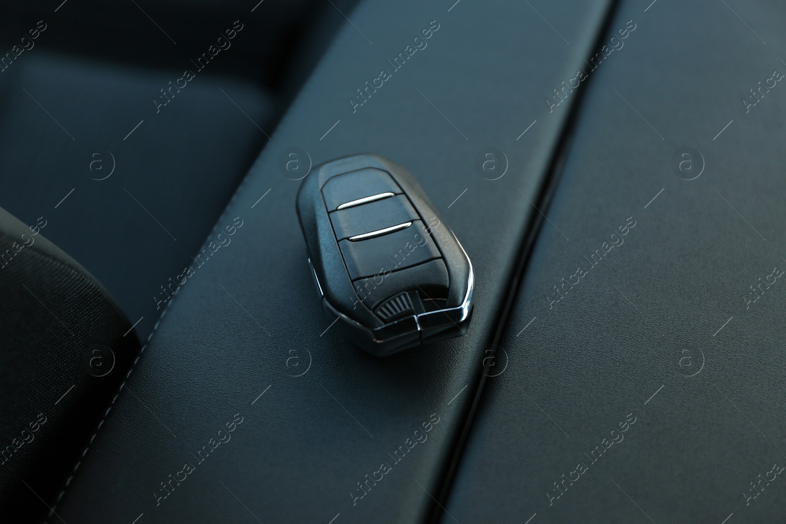 Photo of Car flip key inside of modern automobile, closeup